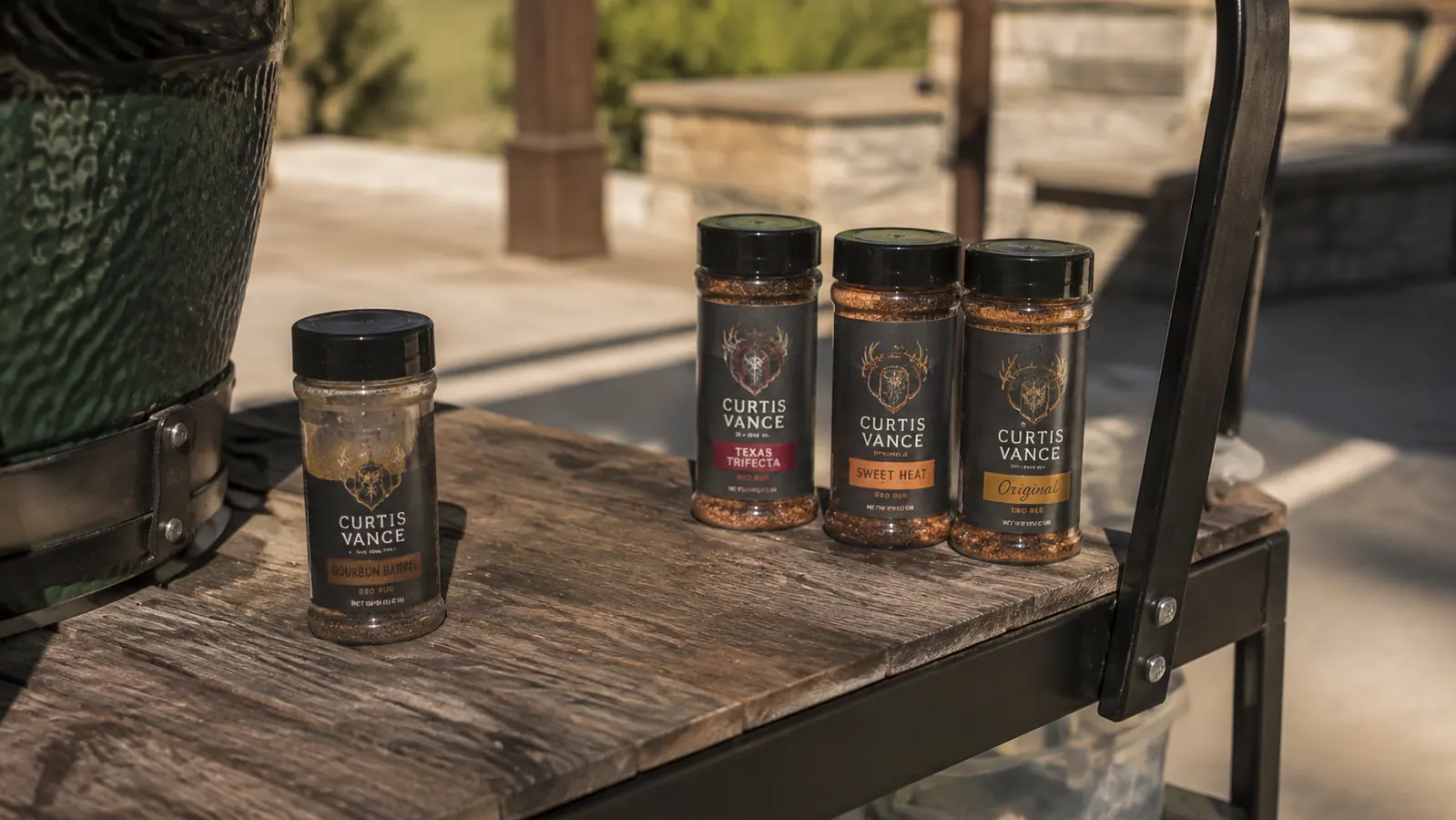 One nearly empty small rub jar sitting apart from three other jars on a wooden grill cart shelf